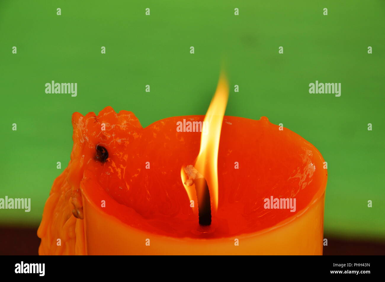 yellow candle burning in temple Stock Photo Alamy