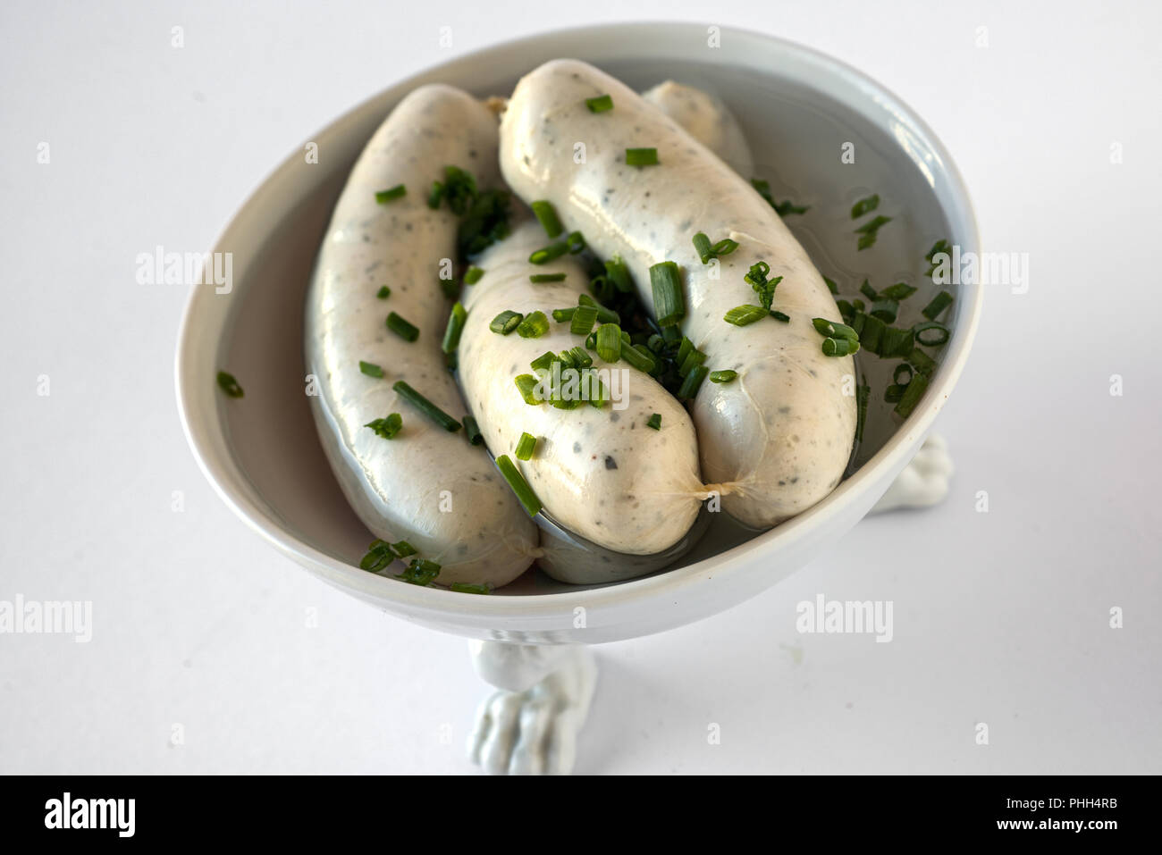 Bavarian veal sausages in an old Nymphenburg bowl Stock Photo Alamy