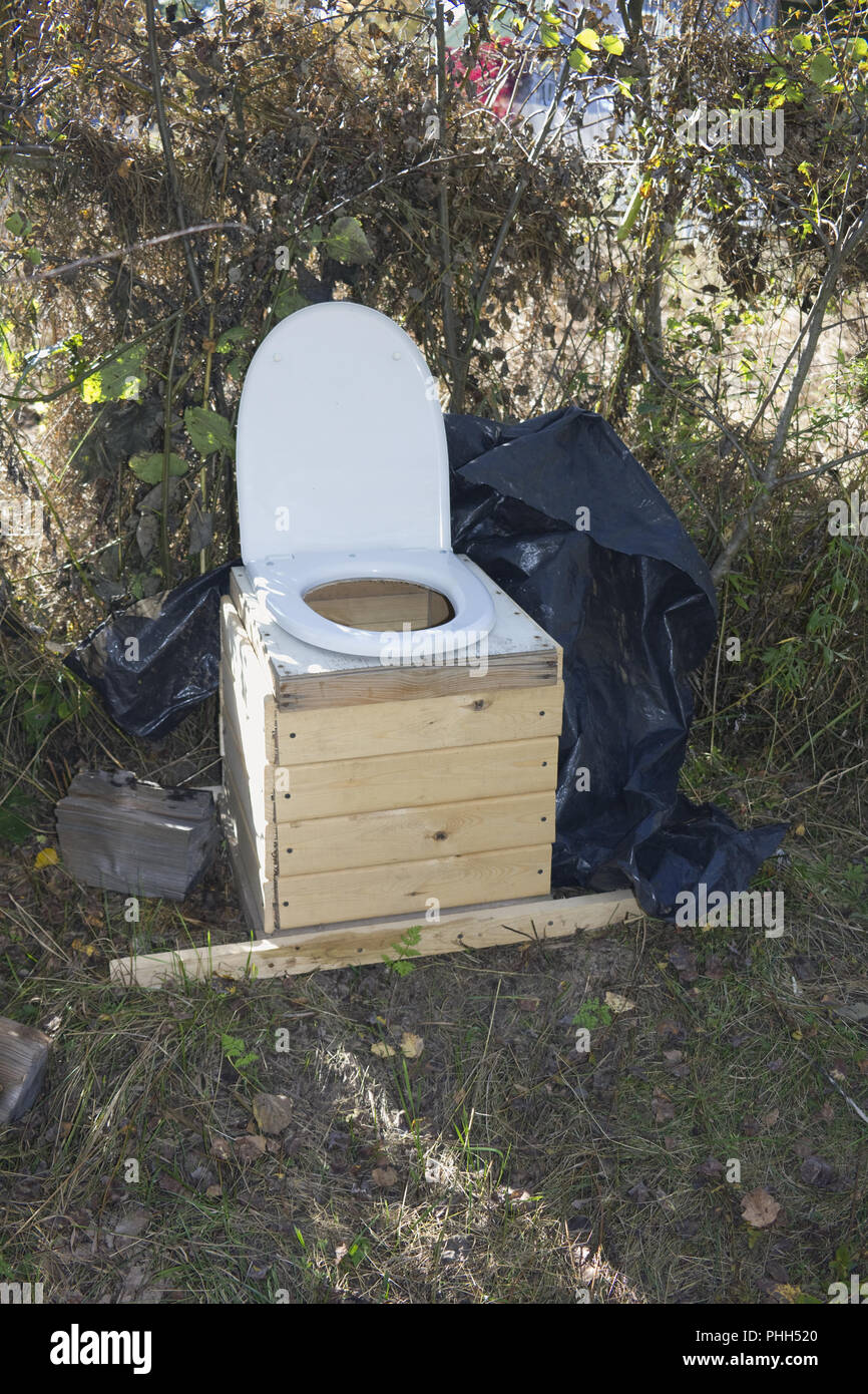 Mobile homemade village toilet cloaks for defecation in the forest Stock Photo