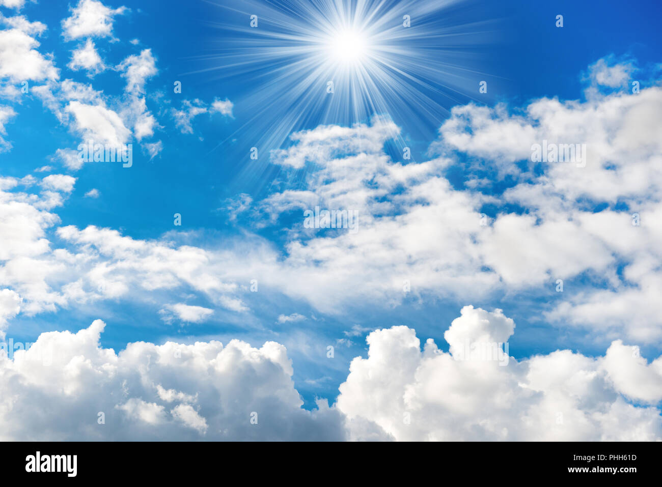 Shining sun and rays on the blue sky Stock Photo