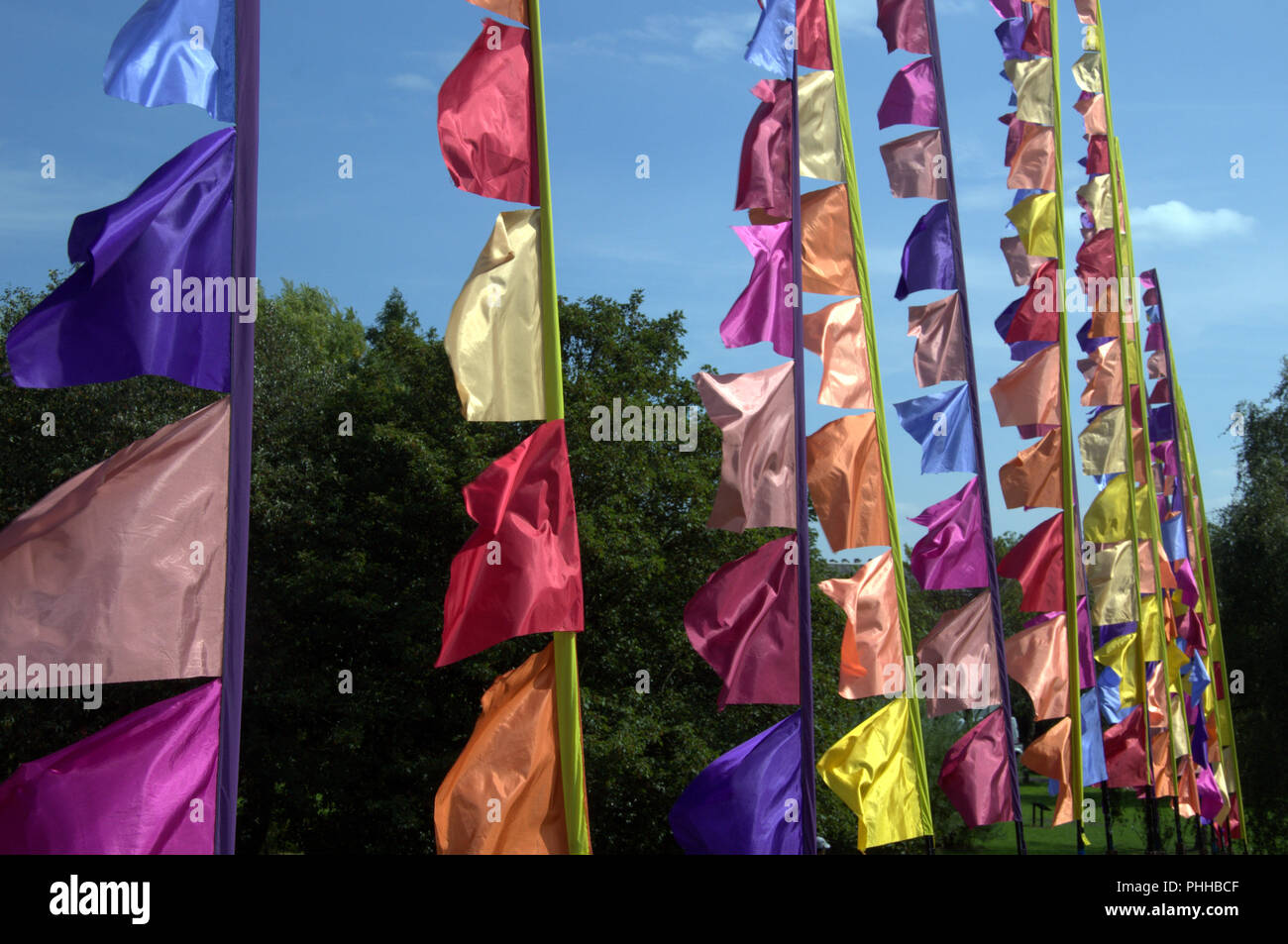 Manchester, UK. 1 September, 2018. The first Festival of Manchester in Platt Fields Park. Decorative flags flying in the wind. Stock Photo