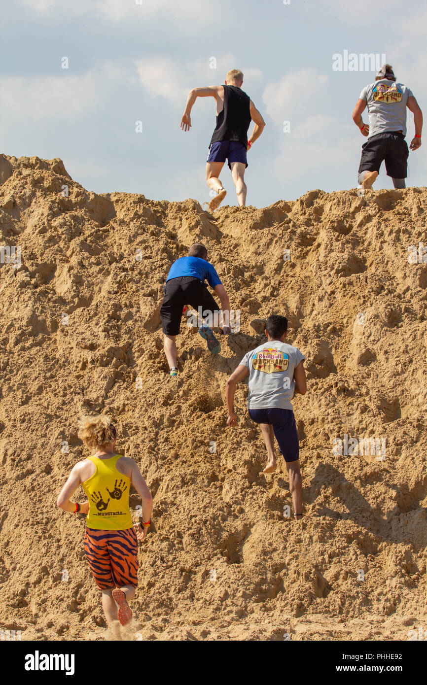 Margate, Kent, UK. 1st September, 2018. Red Bull has brought 'Quicksand' to the seaside town of Margate. An endurance course on the golden sands with castles, hills, trenches and rollers to test the competitors to the point of exhaustion.  How hard can a mile be? Credit: ernie jordan/Alamy Live News Stock Photo