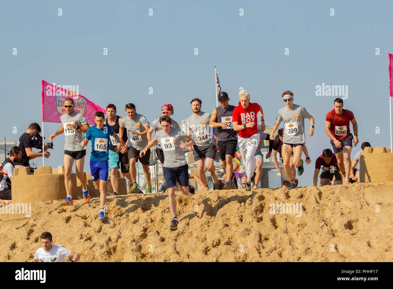 Margate, Kent, UK. 1st September, 2018. Red Bull has brought 'Quicksand' to the seaside town of Margate. An endurance course on the golden sands with castles, hills, trenches and rollers to test the competitors to the point of exhaustion.  How hard can a mile be? Credit: ernie jordan/Alamy Live News Stock Photo
