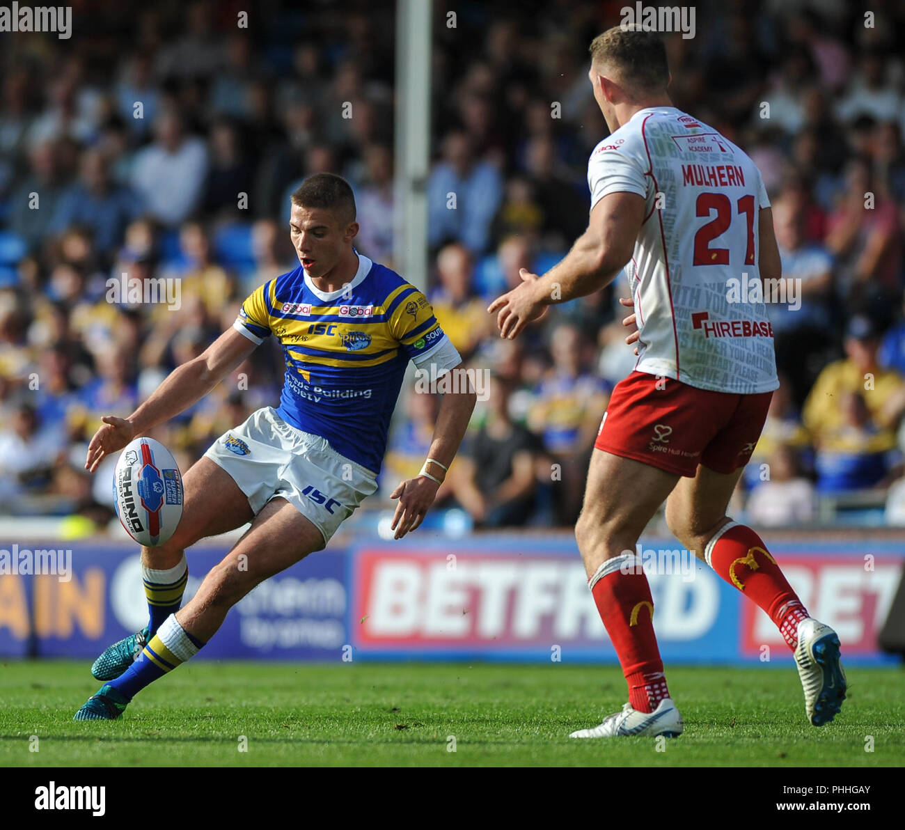 Emerald Headingley Stadium, Leeds, UK. 1st September 2018. Rugby League Super 8's Qualifiers Rugby League between Leeds Rhinos vs Hull Kingston Rovers; Jack Walker of Leeds Rhinos attempts a chip over Robbie Mulhern of Hull Kingston Rovers.  Dean Williams Stock Photo