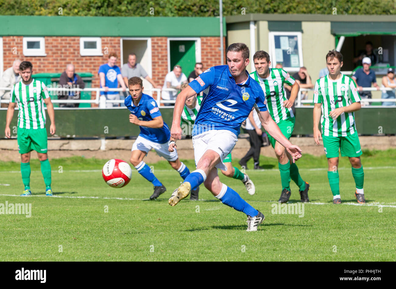 East Riding of Yorkshire, UK. 01 September 2018 - North Ferriby United A.F.C in the East Riding of Yorkshire, England, known as The Villagers and playing in green, hosted a match against Warrington Town AFC, known as The Yellows and The Wire and playing in blue, Both clubs play in the Evo Stik Northern Premier League Premier Division, the seventh tier of English football. Credit: John Hopkins/Alamy Live News Stock Photo