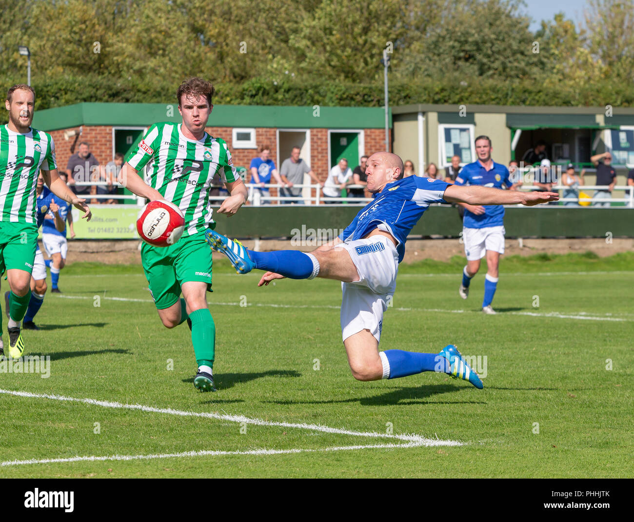 East Riding of Yorkshire, UK. 01 September 2018 - North Ferriby United A.F.C in the East Riding of Yorkshire, England, known as The Villagers and playing in green, hosted a match against Warrington Town AFC, known as The Yellows and The Wire and playing in blue, Both clubs play in the Evo Stik Northern Premier League Premier Division, the seventh tier of English football. Credit: John Hopkins/Alamy Live News Stock Photo