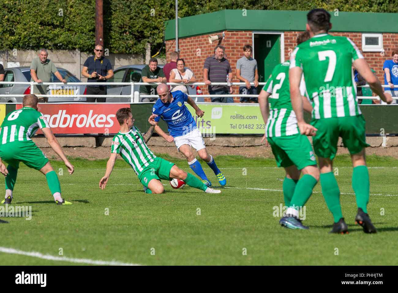 East Riding of Yorkshire, UK. 01 September 2018 - North Ferriby United A.F.C in the East Riding of Yorkshire, England, known as The Villagers and playing in green, hosted a match against Warrington Town AFC, known as The Yellows and The Wire and playing in blue, Both clubs play in the Evo Stik Northern Premier League Premier Division, the seventh tier of English football. Credit: John Hopkins/Alamy Live News Stock Photo