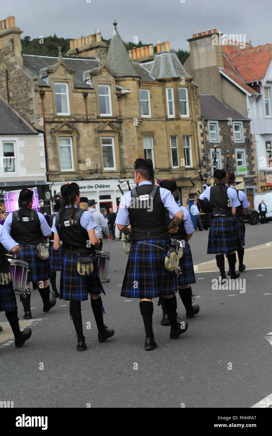 Pipe and Drums Bands Street Parade. Pipers and drummers playing and marching  through the streets of Peebles to finish Highland Games. 1st September 2018, Peebles, Scotland, United Kingdom Stock Photo
