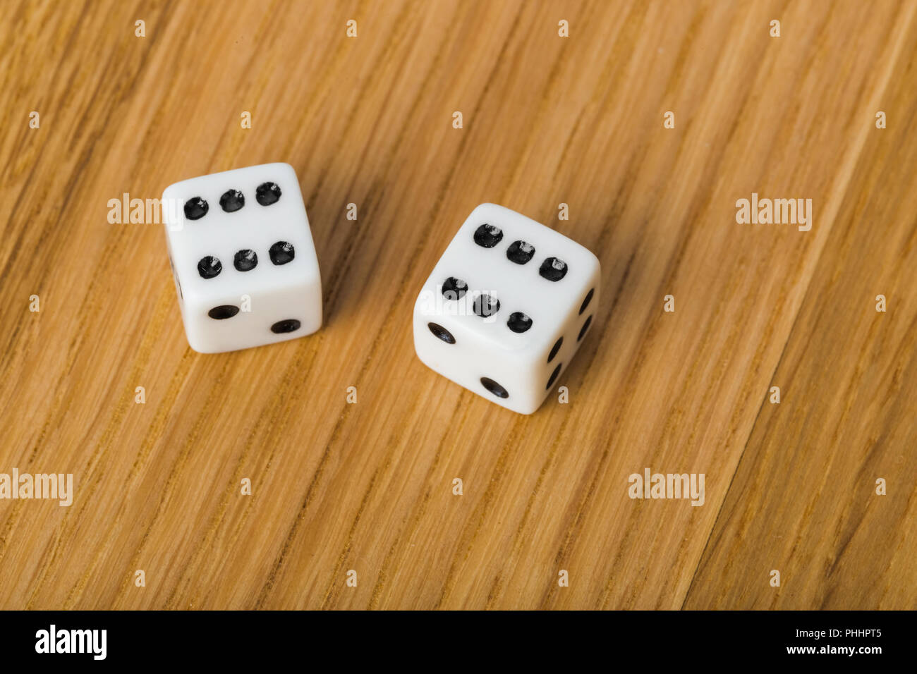 Backgammon dices on wood background Stock Photo