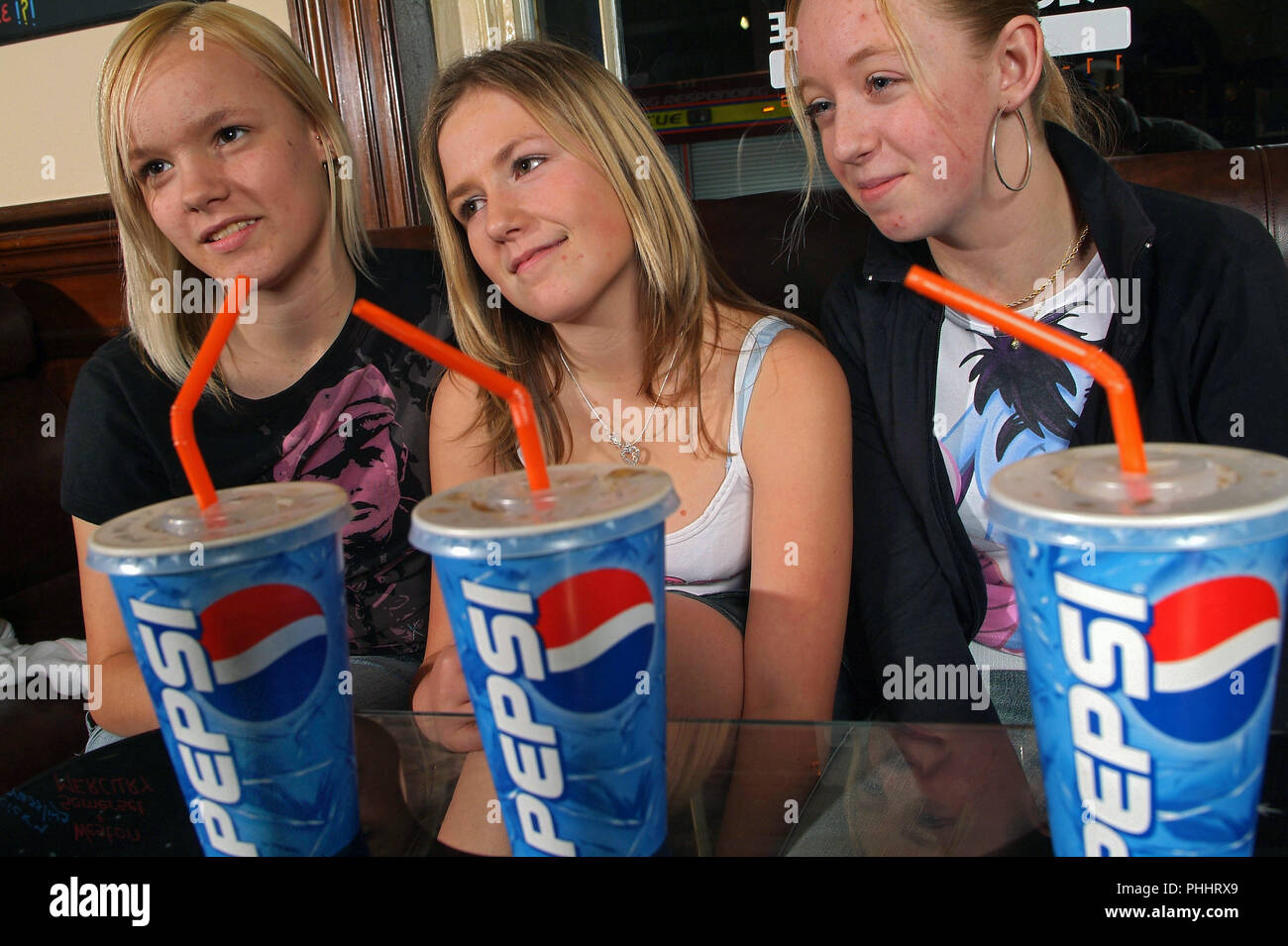 Adolescents drinking soft drinks at an alcohol-free bar in Weston-Super-Mare,Somerset,UK Stock Photo