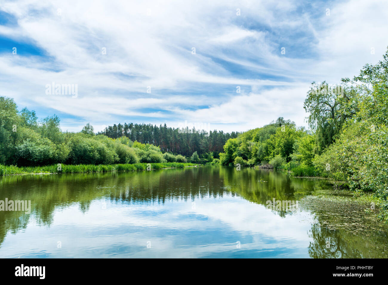 Calm landscape with blue river Stock Photo - Alamy