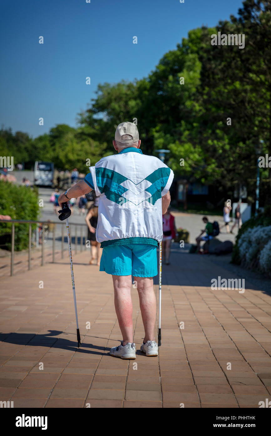 An old man with crutches to walk and run Stock Photo Alamy