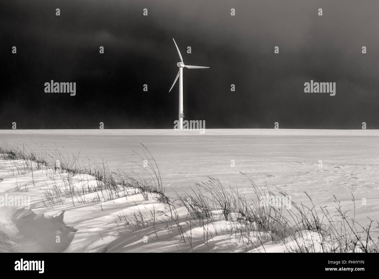 The wind turbine in the snowy field Stock Photo - Alamy