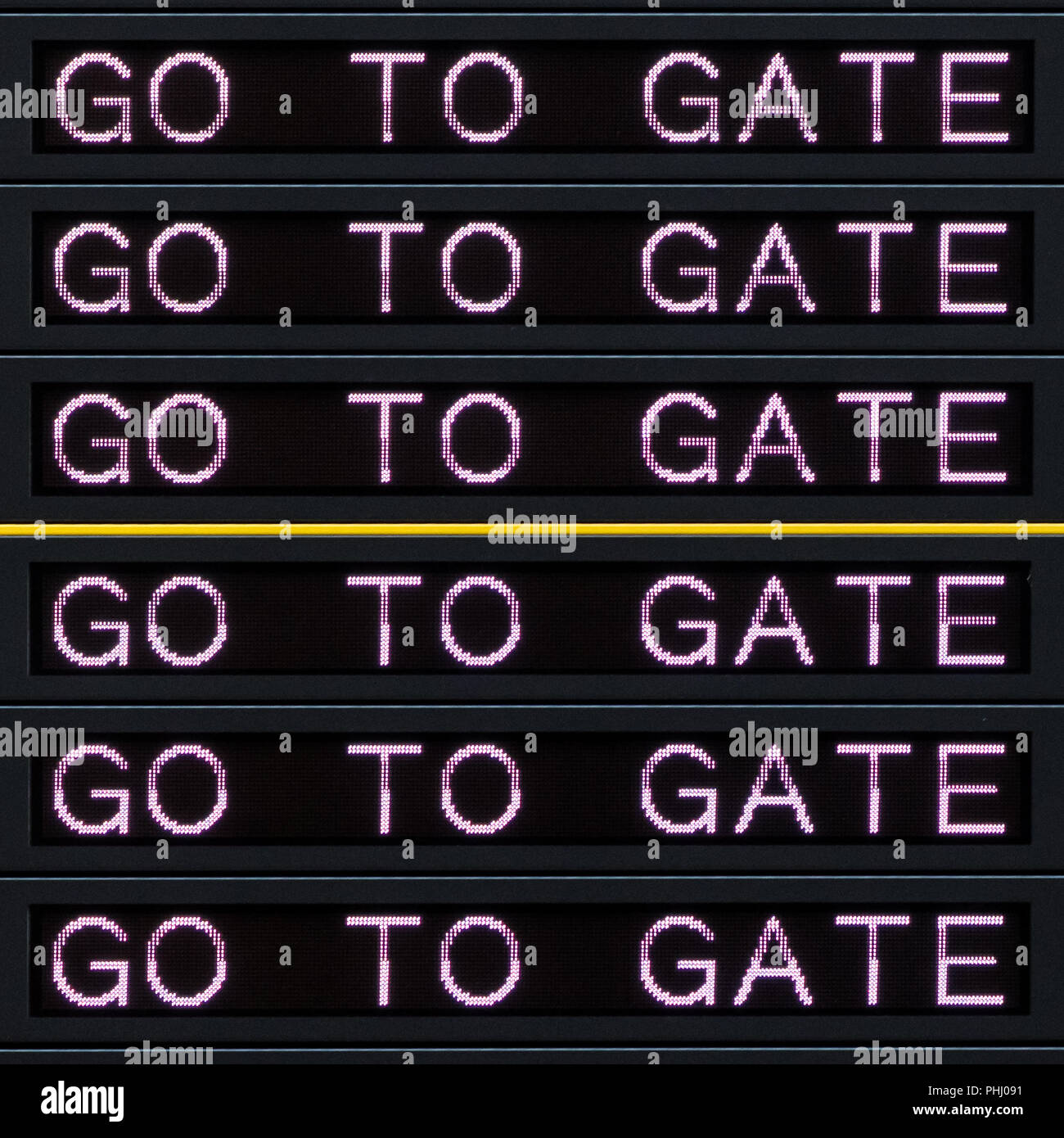 Airport departure board with go to gate sign Stock Photo Alamy