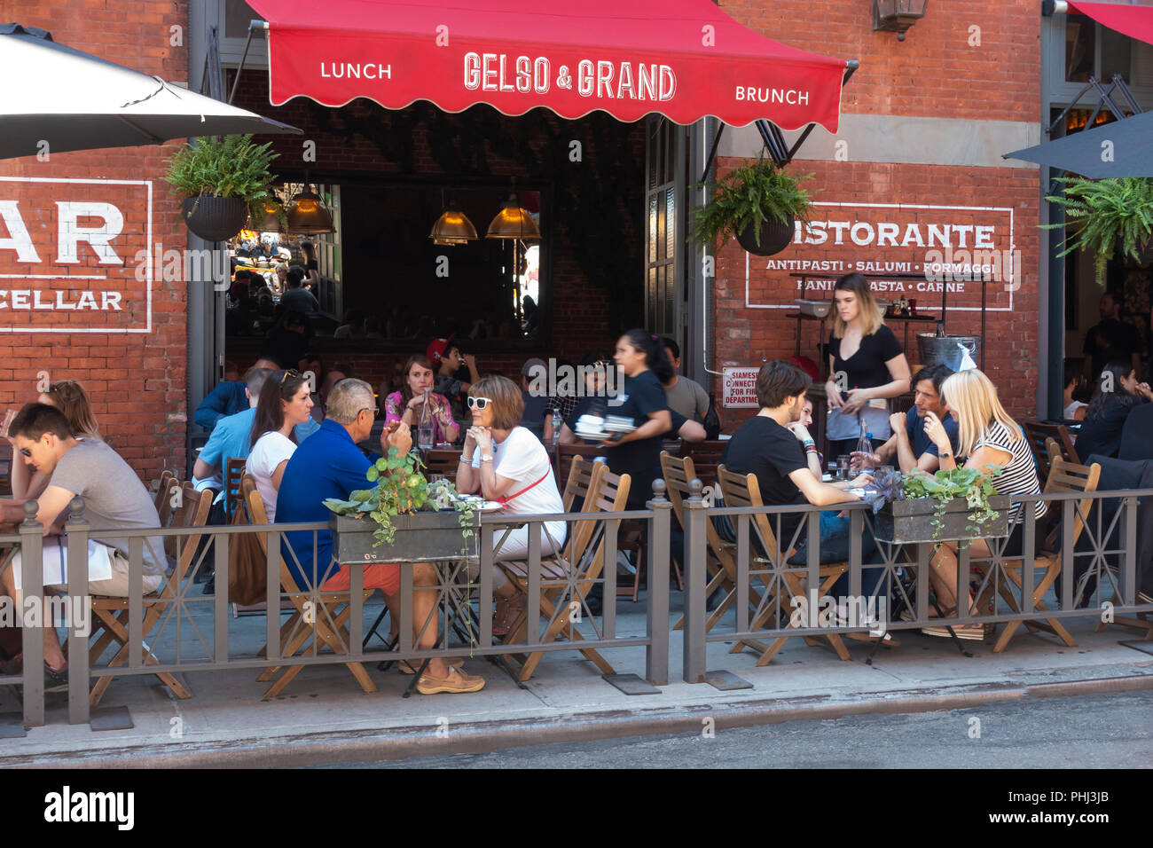 Alfresco dining at Gelso & Grand in Mulberry Street in Little Italy, New York City Stock Photo