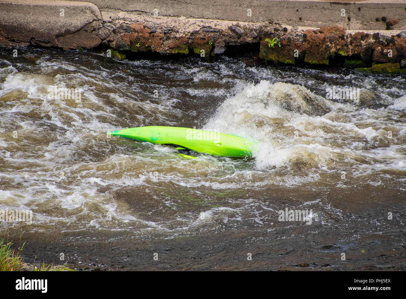 Capsized canoe in white water rapids on the river Dee Stock Photo - Alamy