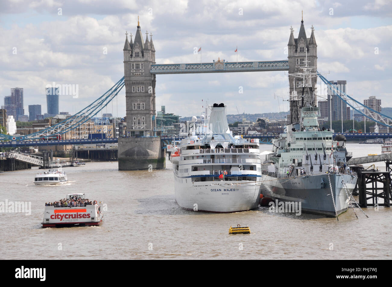 Tower bridge, London with HMS Belfast and a cruise ship in foreground on the Thames Stock Photo