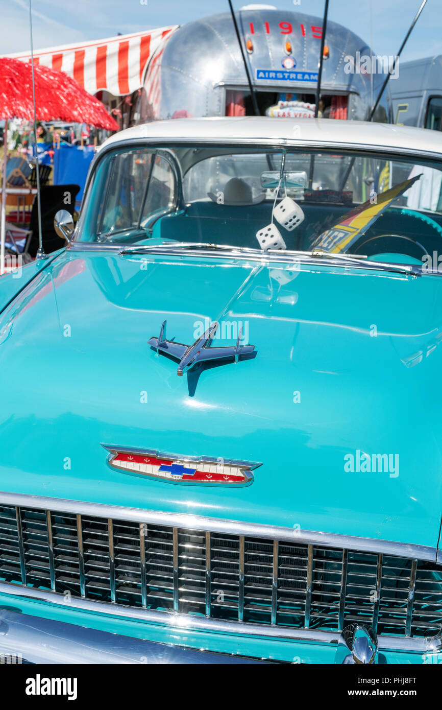 1955 Chevrolet Belair and an airstream caravan and at a vintage retro festival. UK. Stock Photo