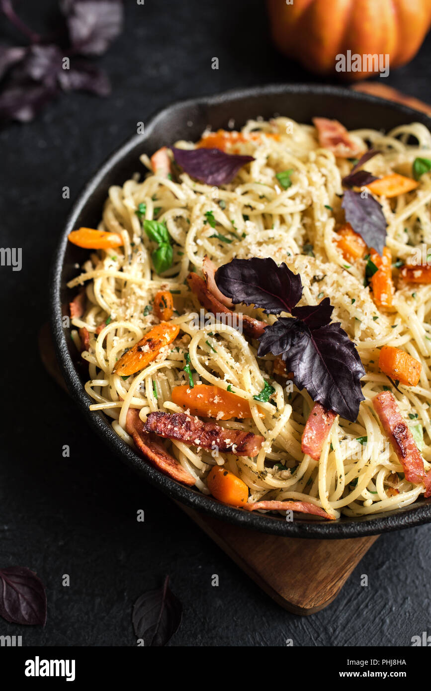 Autumn Pasta With Pumpkin And Bacon In Cast Iron Pan Homemade Spaghetti Pumpkin Pasta With Bacon Parmesan Cheese And Basil On Black Copy Space Aut Stock Photo Alamy
