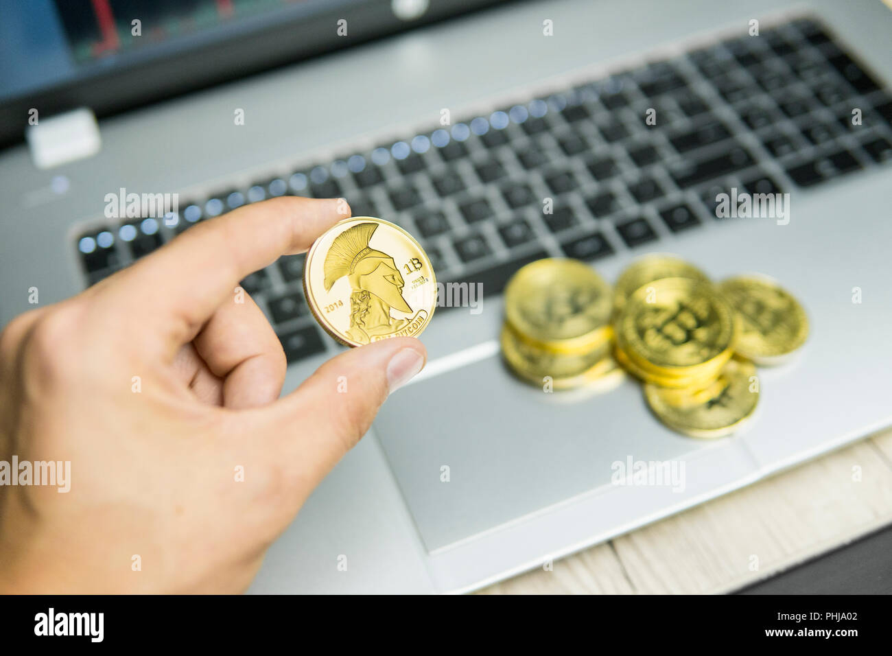 Golden titan bitcoin on white background close up Stock Photo - Alamy