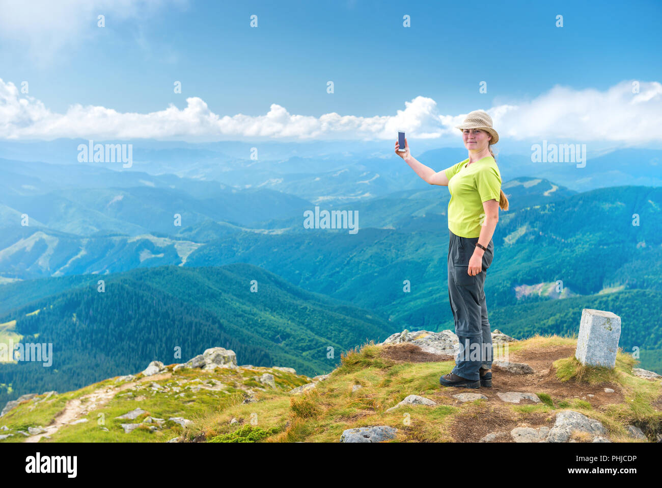 Young woman on top mountain hi-res stock photography and images - Alamy