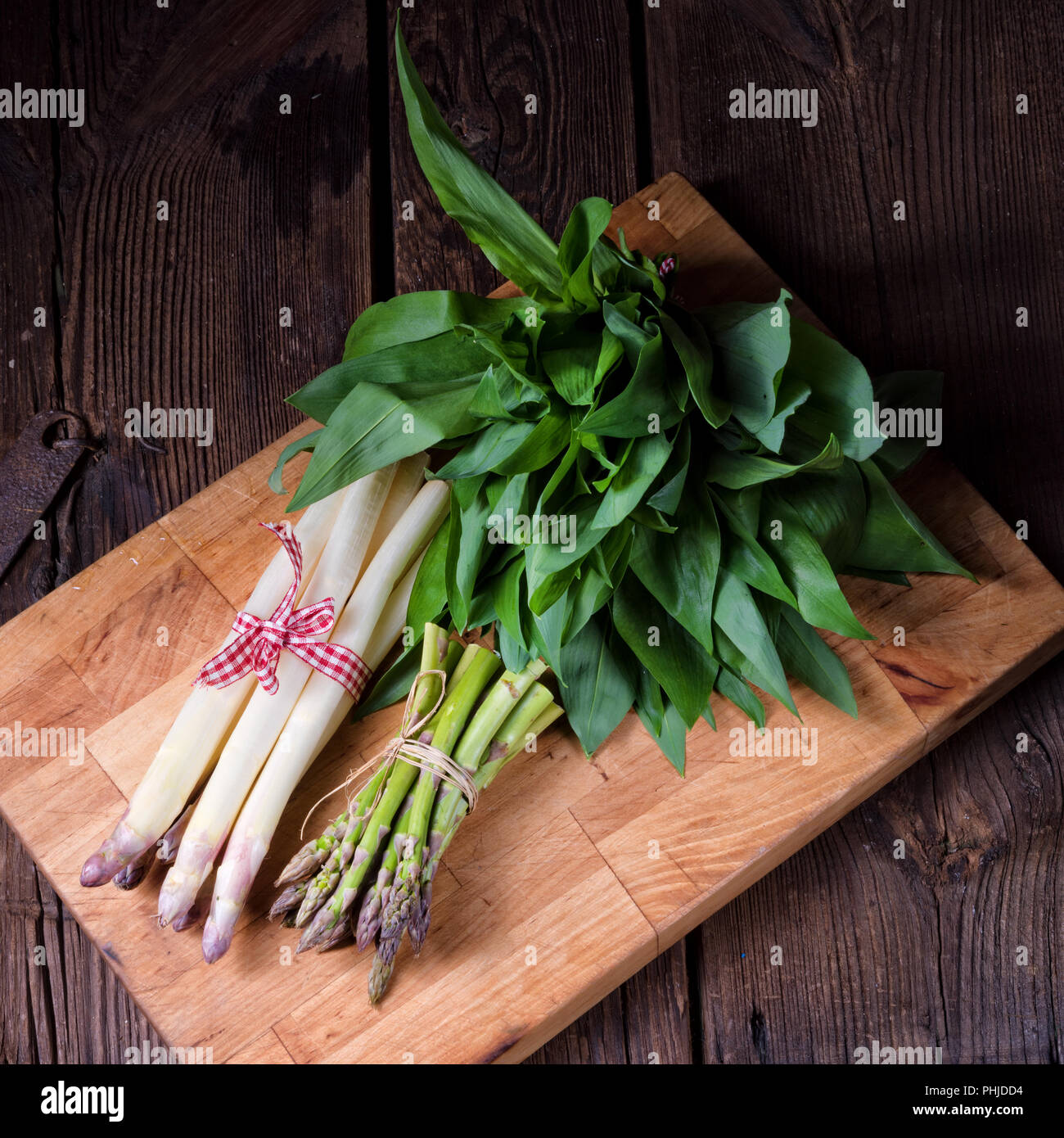 Bear's garlic with white and green asparagus Stock Photo