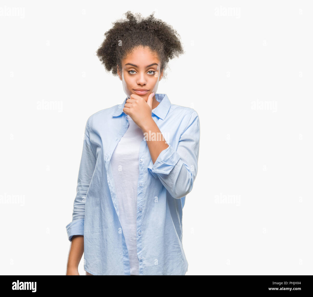 Young afro american woman over isolated background looking confident at ...