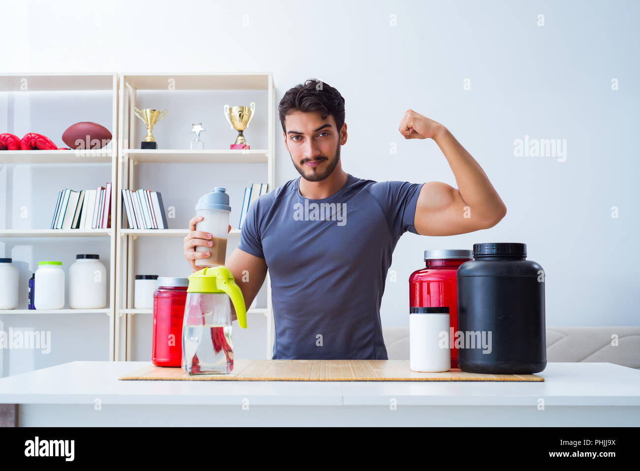 Athlete tasting new protein supplements for better muscles Stock Photo Alamy