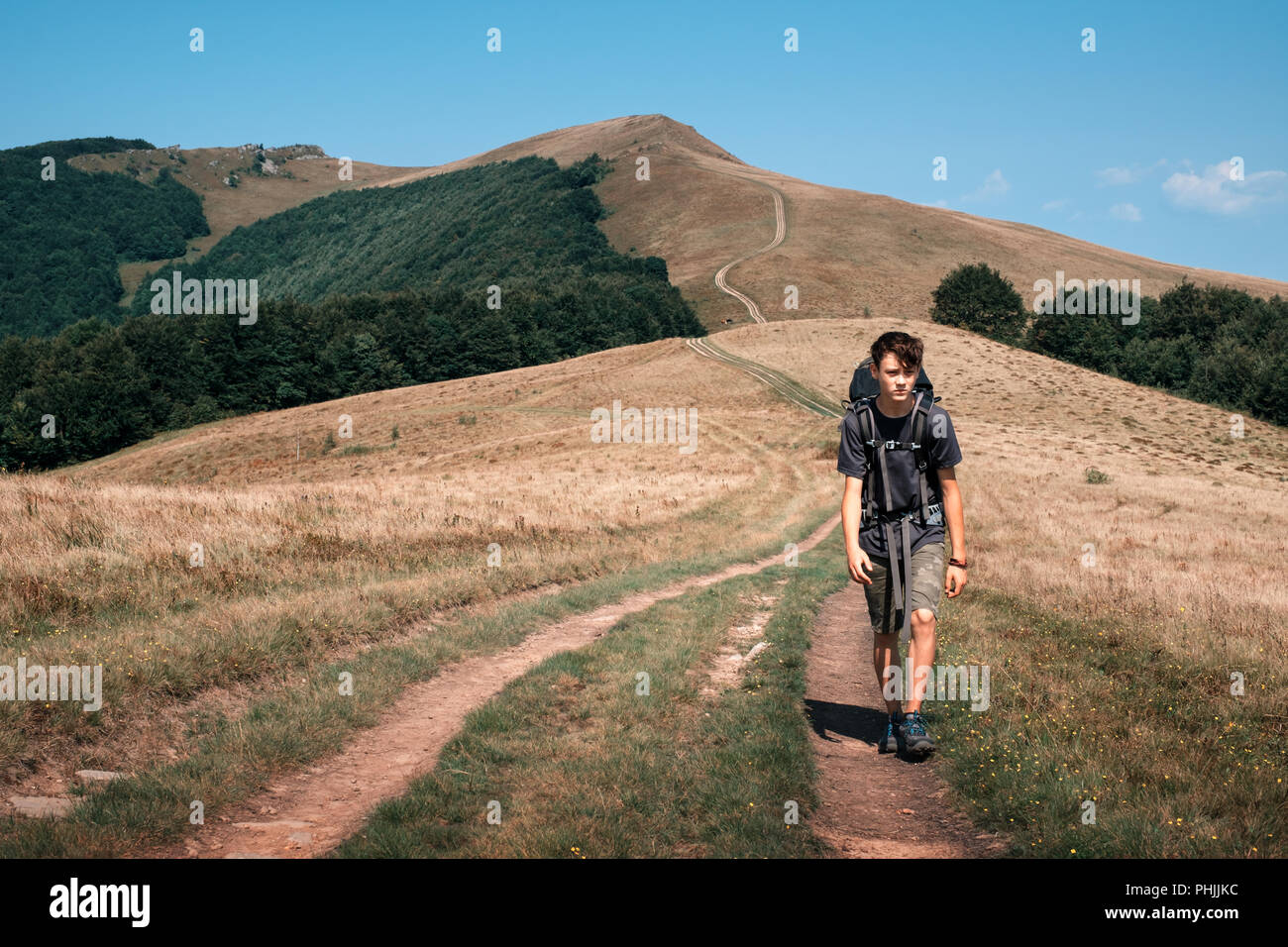 Alone tourist hiking in the mountains Stock Photo