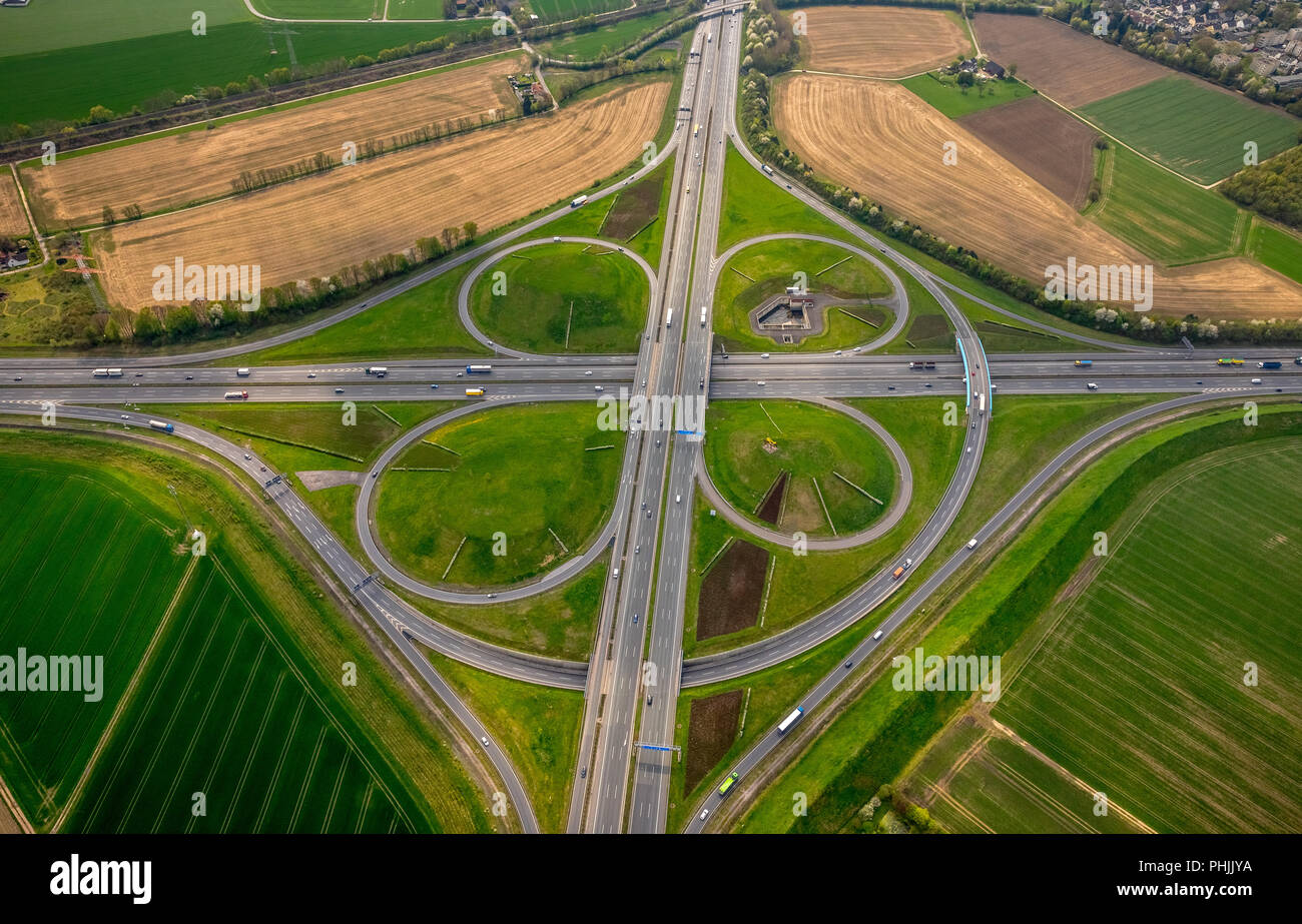 Kamener Kreuz, motorway intersection A1 and A2 in Kamen, tangential carriageway with ramp, Kleeblatt, Eight Angels a yellow ADAC helicopter, in NRW. K Stock Photo