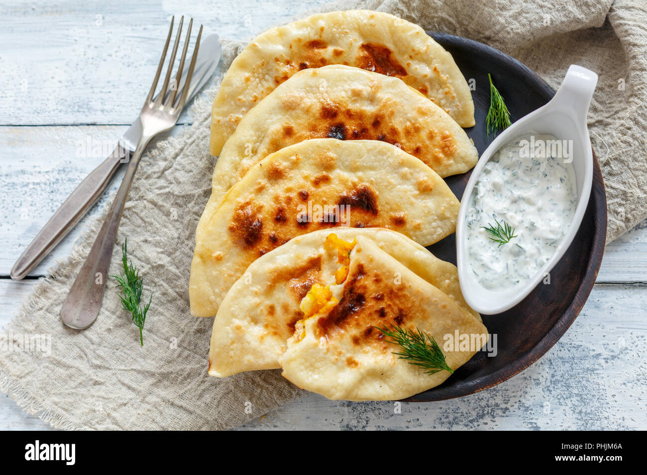 Flat bread with pumpkin filling. Azerbaijani cuisine. Stock Photo