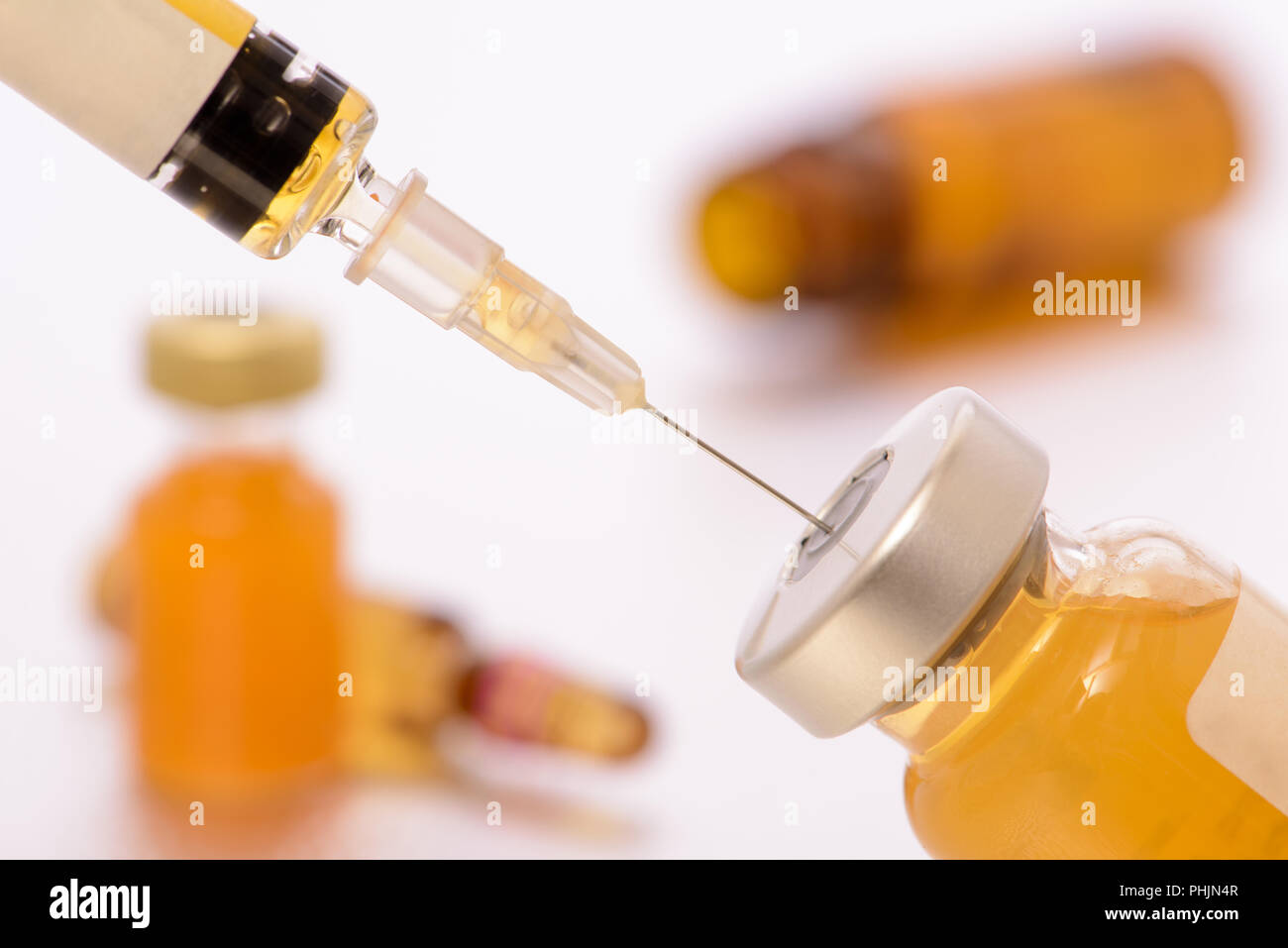 medical injection and vaccination with syringe and serum Stock Photo