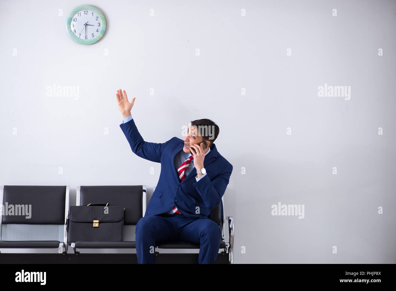Man wairing to boarding in airport lounge room Stock Photo