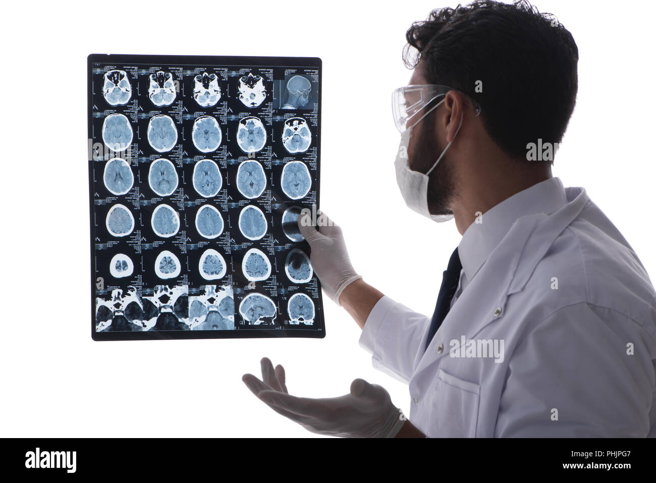 Young doctor looking at x-ray images isolated on white Stock Photo - Alamy