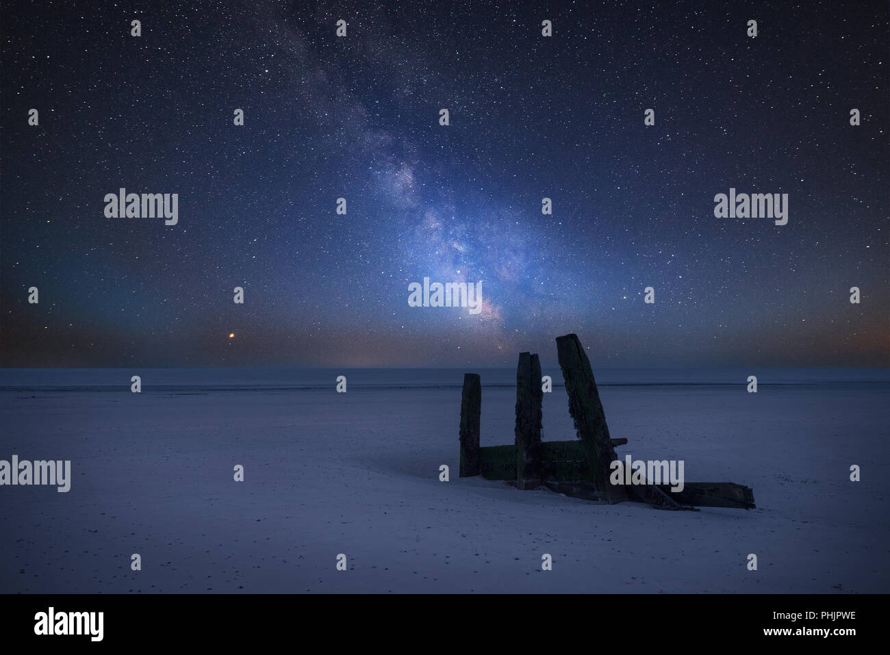 Stunning vibrant Milky Way composite image over landscape of empty ...