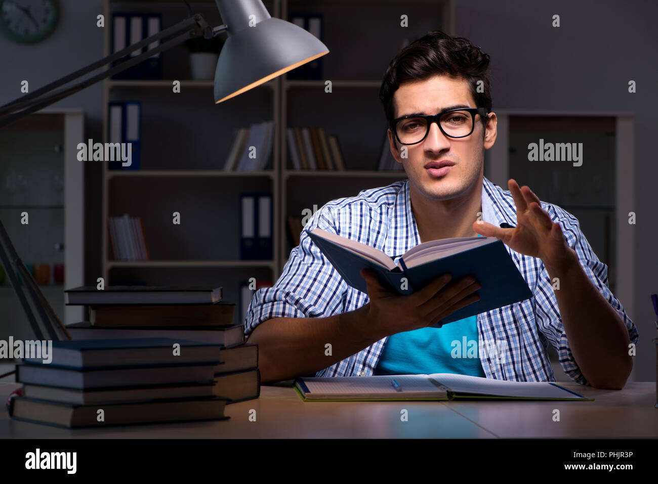 Student preparing for exams late night at home Stock Photo - Alamy