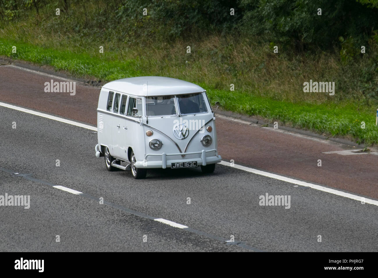 1965 60s white VW Volkswagen split-screen kombi van; Vintage VW, classic car, old retro vehicle, UK Stock Photo