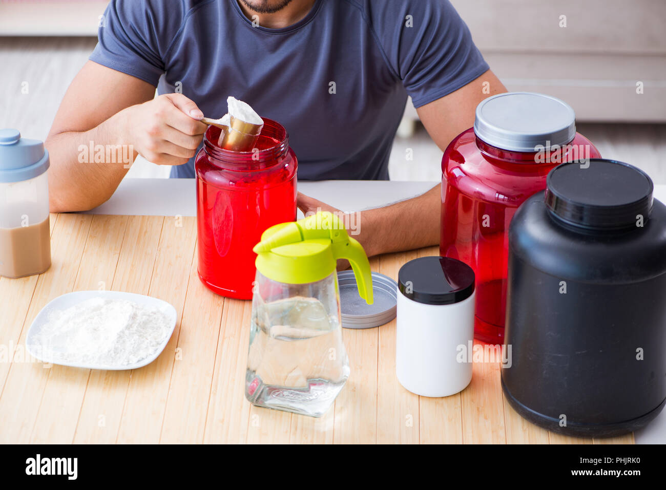 Athlete tasting new protein supplements for better muscles Stock Photo Alamy