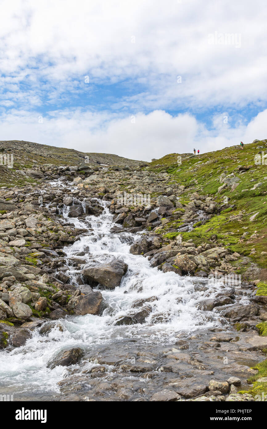 Waterfall at a mountainside in high country Stock Photo