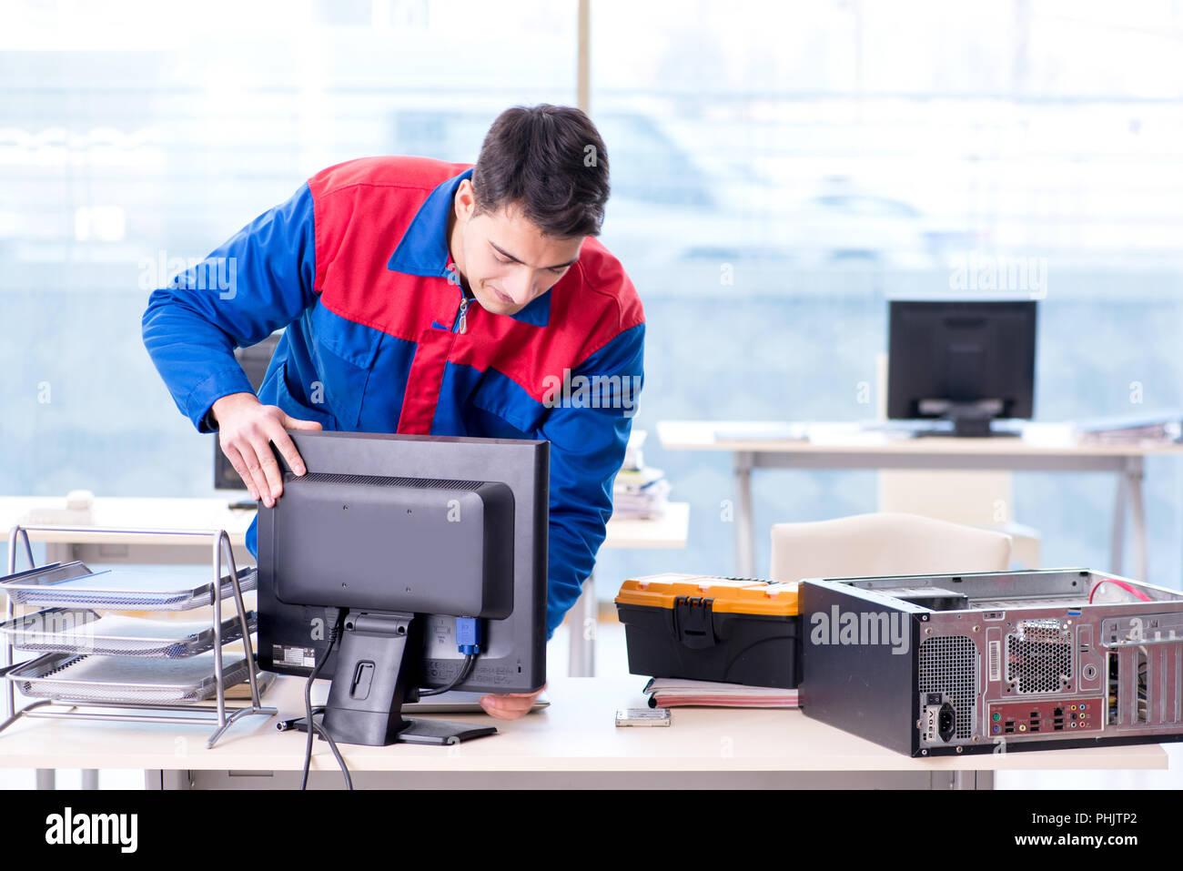 Computer repairman specialist repairing computer desktop Stock Photo ...