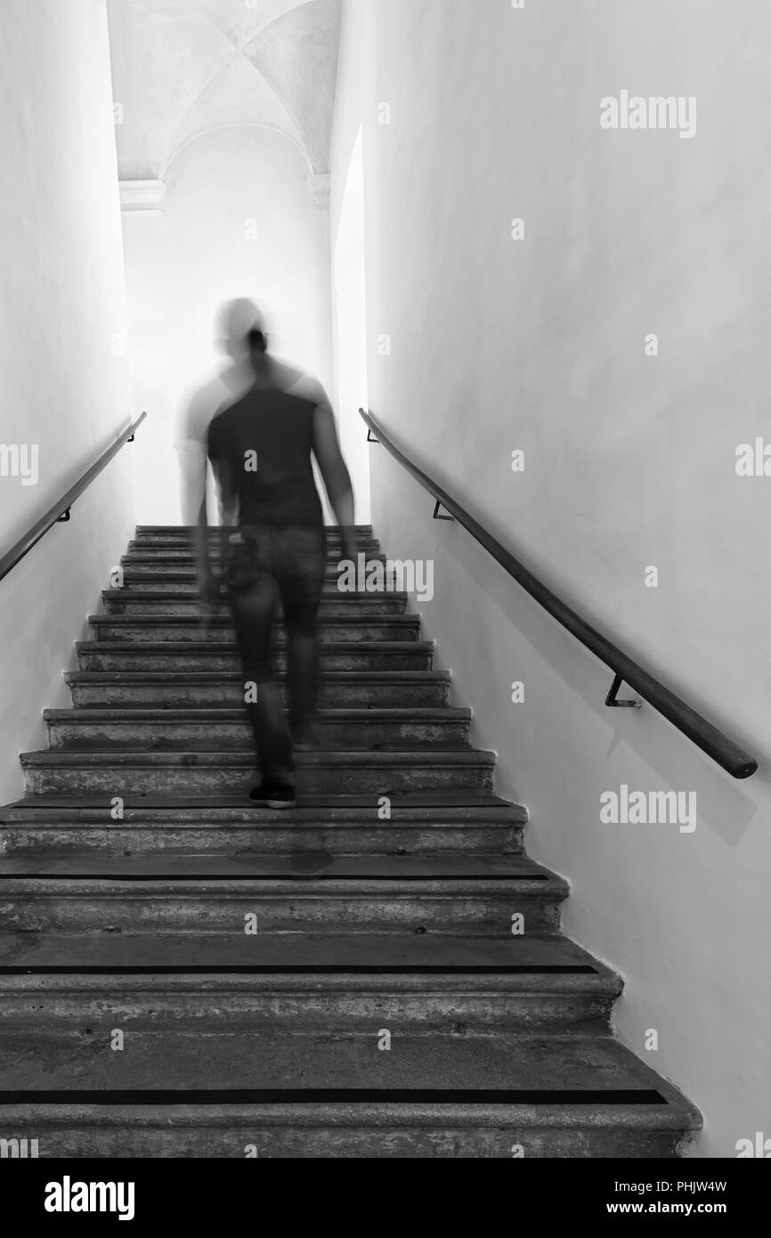 Man walking up stairs, motion blur Stock Photo