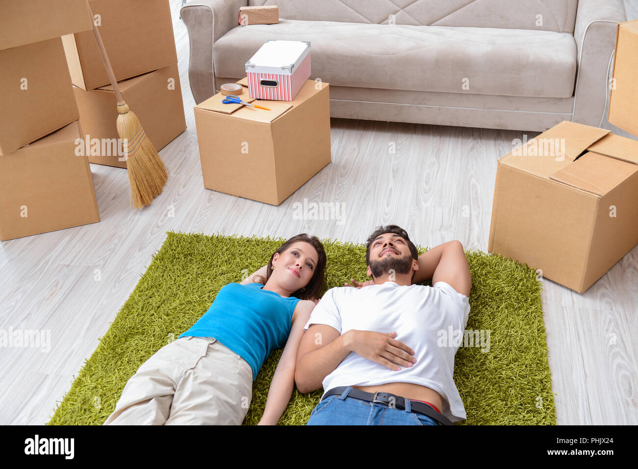 Tired family relaxing moving house hi-res stock photography and images ...