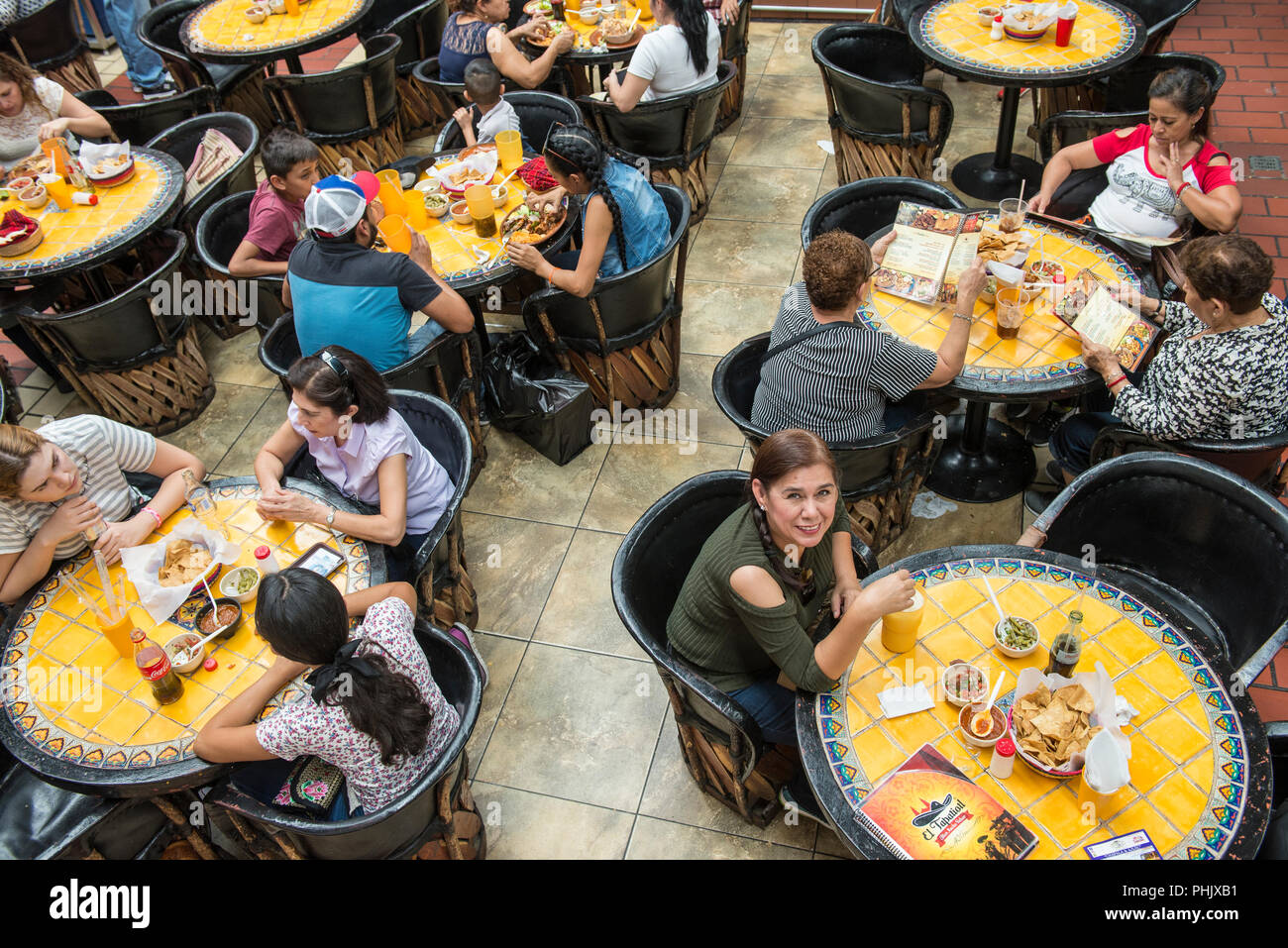 People eating at Juan de Dios Market in the historical center of