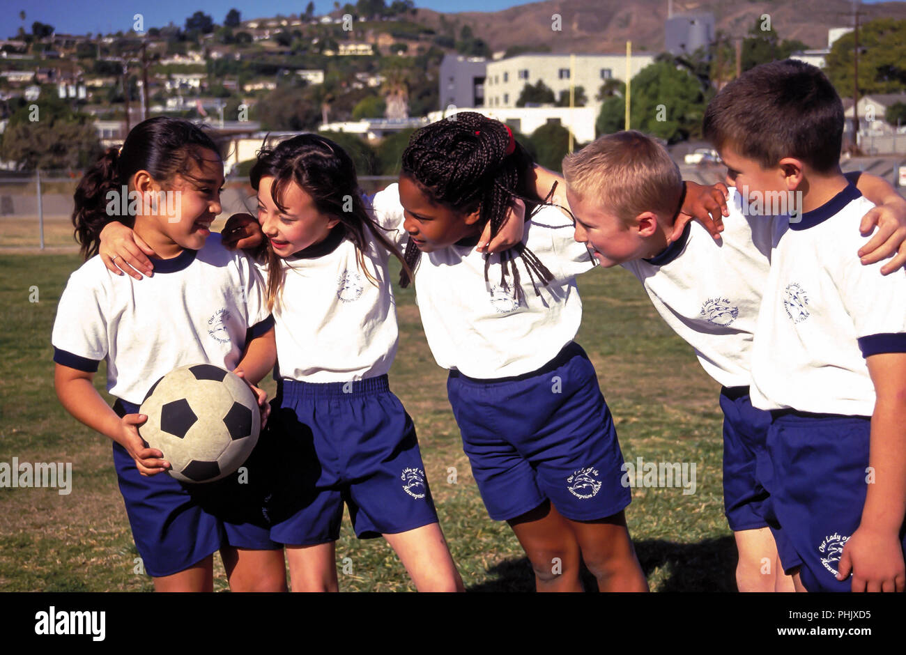 Group of young kids lined up in a row with arms around each other  © Myrleen Pearson  ...Ferguson Cate Stock Photo