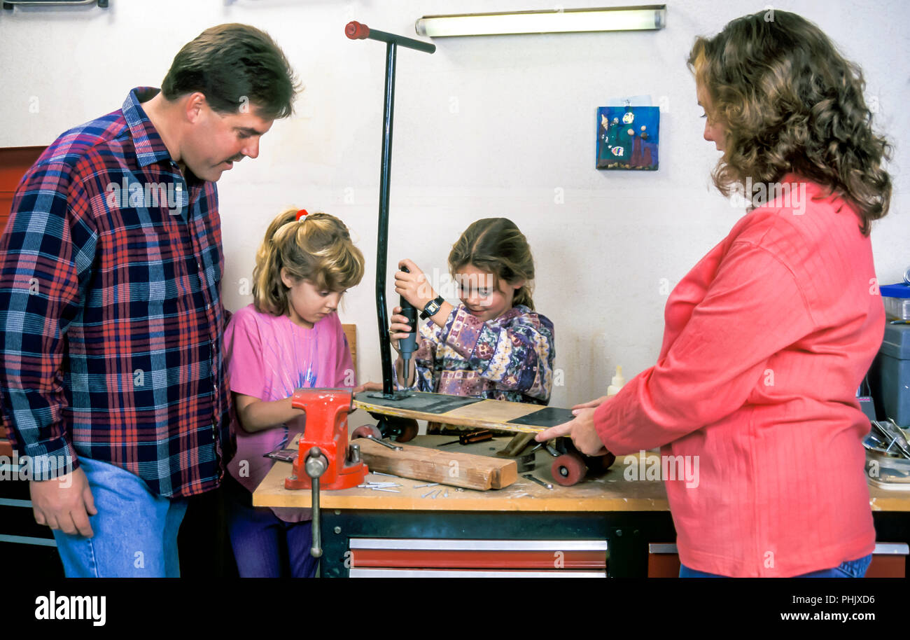 Family working together in home garage workshop. MR © Myrleen Pearson  ...Ferguson Cate Stock Photo