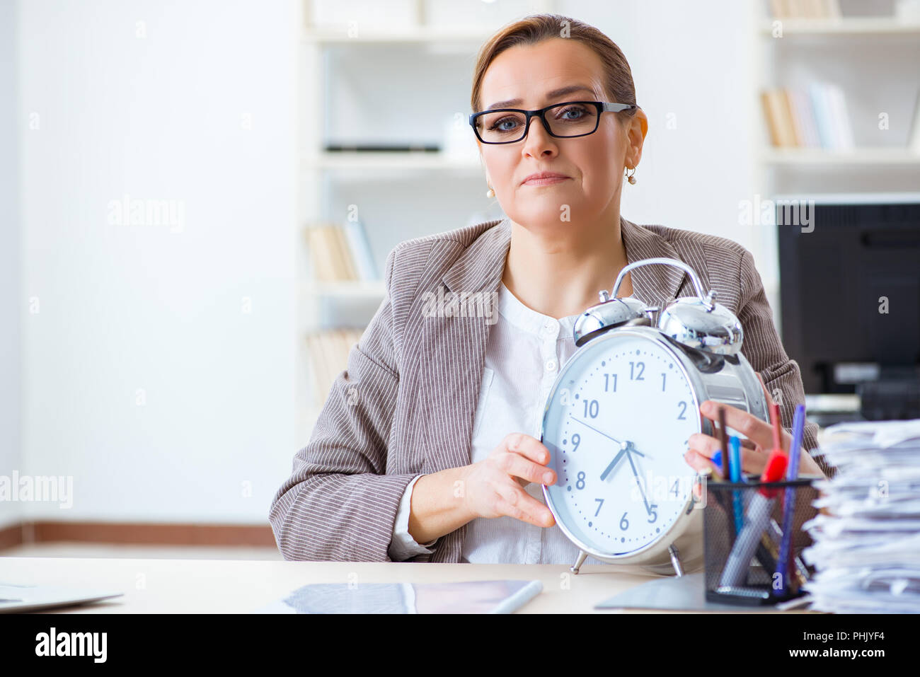 Business woman trying finish work hi-res stock photography and images ...