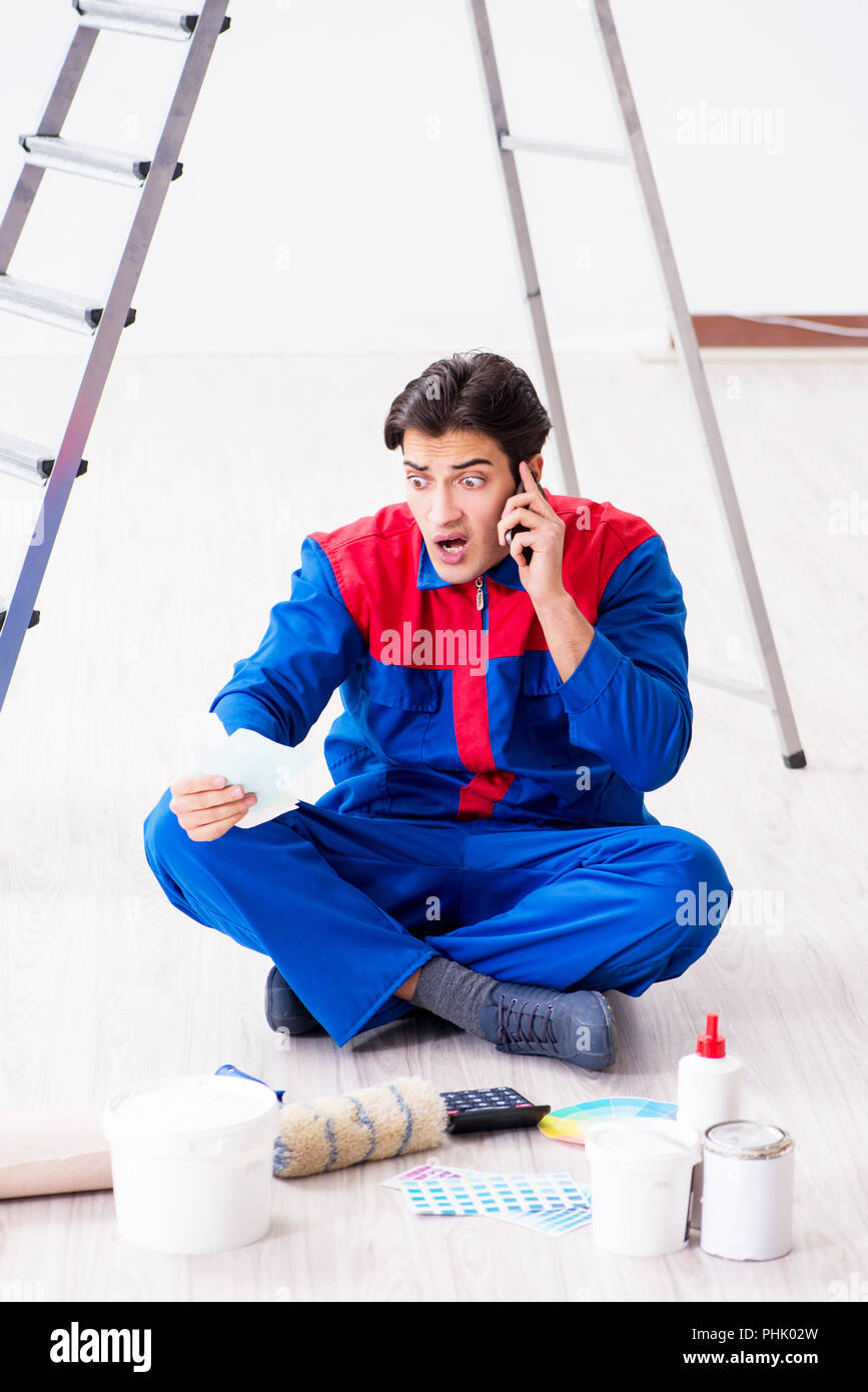 Young painter trying to match colours for painting job Stock Photo Alamy