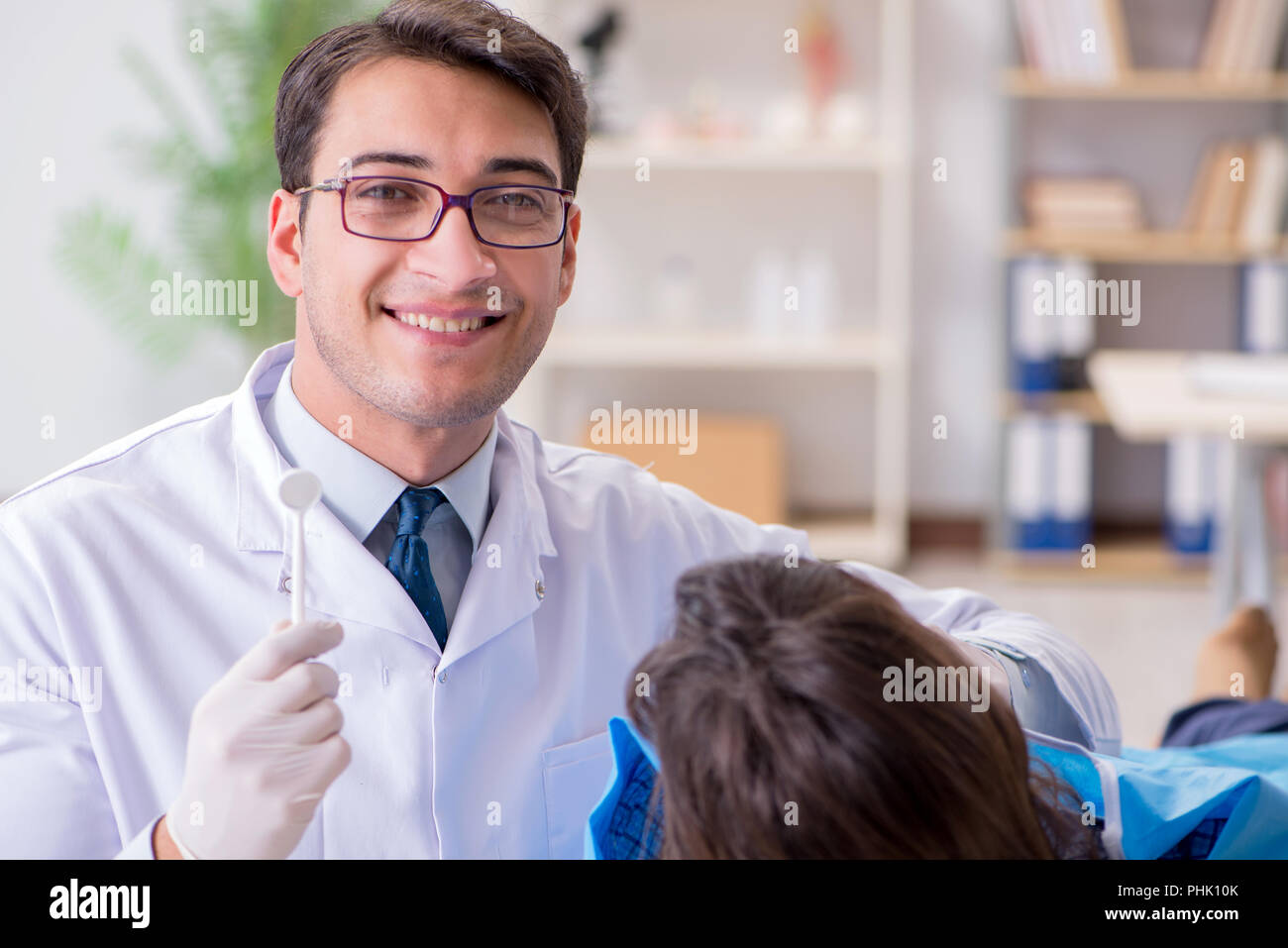 Patient visiting dentist for regular checkup and filling Stock Photo
