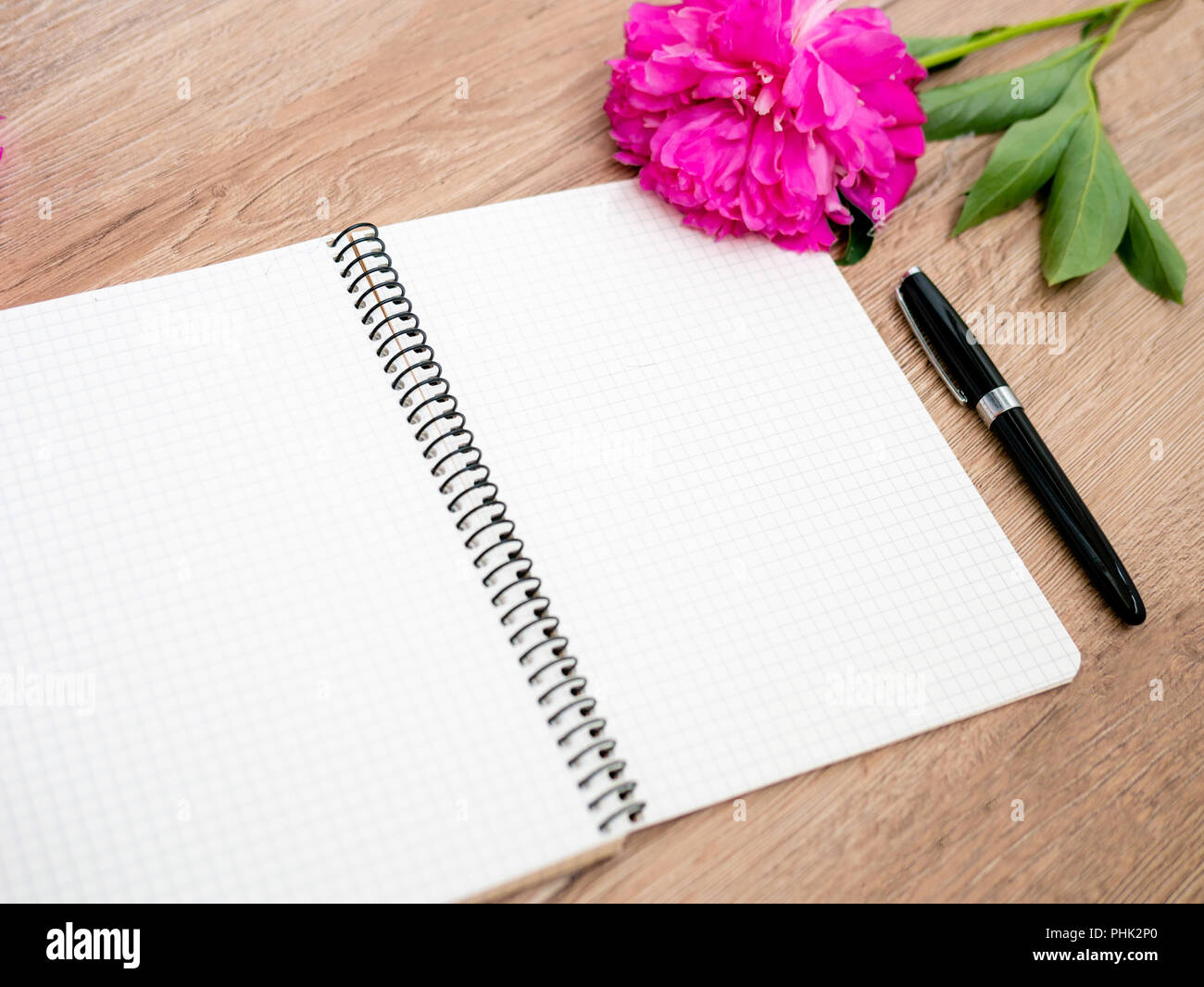 Pink floral assorted pink flower on wooden background with notepad free space, copy space for tekst, Stock Photo