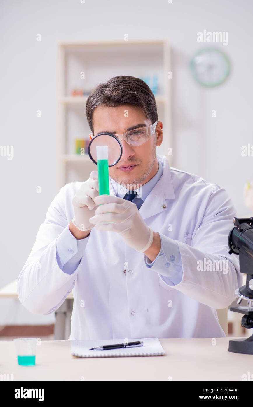 Man student working in chemical lab on experiment Stock Photo Alamy
